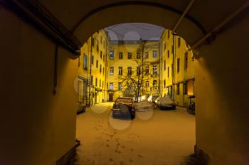 view of urban patio in St Petersburg city in night snowfall