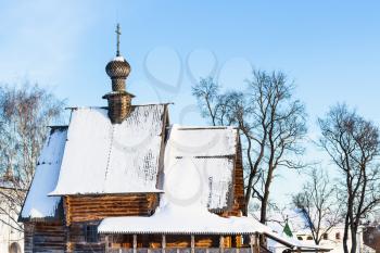 view of wooden Church of St Nicholas the Wonderworker from Glotovo (St Nicholas Church) in Suzdal Kremlin in winter in Vladimir oblast of Russia