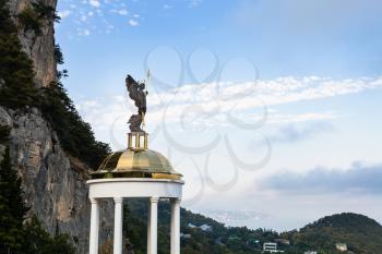 travel to Crimea - view of statue of Holy Archangel Michael on pavilion at the foot of Mount Ai-Nicolas in Oreanda district in evening