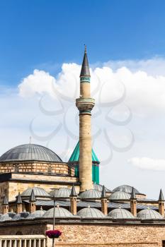 Travel to Turkey - minaret and roofs of Mausoleum of Jalal ad-Din Muhammad Rumi (Mevlana) and Dervish Lodge (Tekke) of the muslim Mevlevi order in Konya city