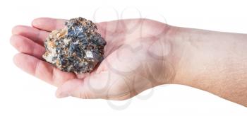 piece of zinc and lead mineral ore (sphalerite with galena) on male palm isolated on white background