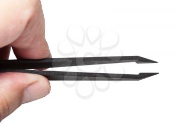 male fingers hold black plastic tweezers with sharp tips isolated on white background