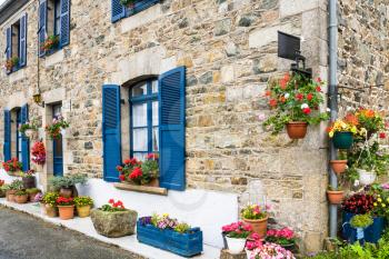 travel in France - typical Breton house on Hent Sant Gonery street in Plougrescant town of the Cotes-d'Armor department in Brittany in summer