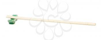 side view of carved disposable wooden chopsticks served on chopstick rest isolated on white background