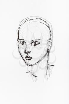 sketch of bald female head hand-drawn by black pencil and ink on white paper