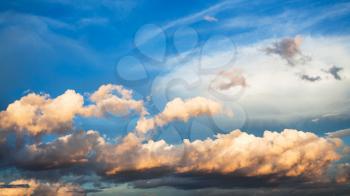 panoramic view of cumuli clouds in dark blue sky over Moscow at summer sunset