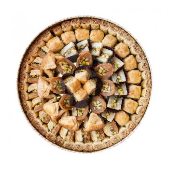 top view of assortment of traditional sweet pastry baklava from local jordanian bakery isolated on white background