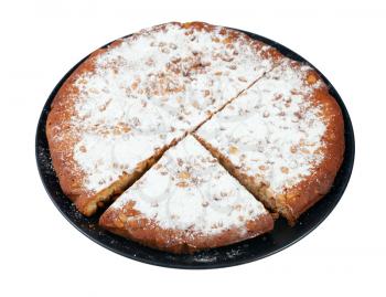 Italian Pine Nut Cake on black plate cut out on white background