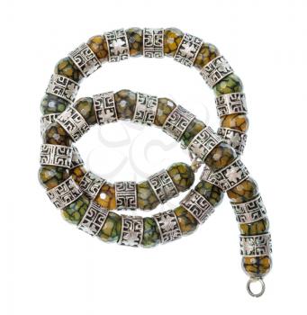 top view of antique arabic coiled necklace from faceted Jadeite gems and silver rings isolated on white background
