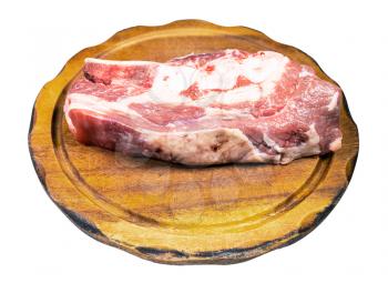 raw piece of beef brisket on wooden cutting board isolated on white background