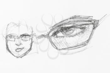 sketch of male head and eye under spectacle hand-drawn by black pencil on white paper