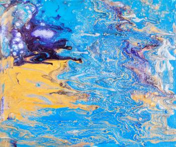 abstract picture handpainted in fluid acrylic flow painting technique by silver, blue, yellow paints on canvas