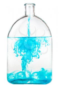 blue watercolour dissolves in water in glass flask isolated on white background