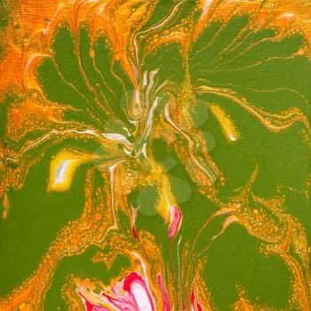 abstract painting with flowing yellow and green acrylic paints