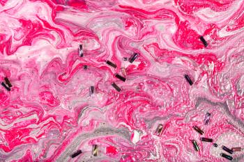 abstract painting with flowing pink and silver acrylic paints decorated by beads