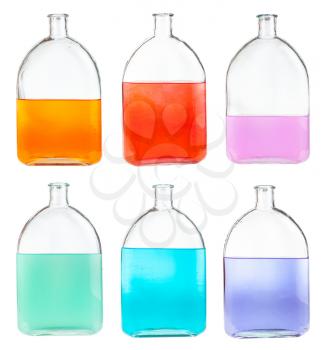 set of various colour mixtures in glass flasks isolated on white background