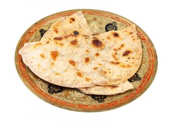 Indian cuisine - tandoori roti (naan flatbread baked in tandoor ) on brass plate isolated on white background