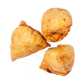 Indian cuisine - top view of three keema samosas (fried savoury pastry filled by meat and vegetables) isolated on white background