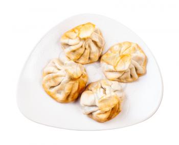 georgian cuisine - top view of roasted khinkali on plate isolated on white background