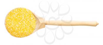 top view of wood spoon with uncooked coarse maize cornmeal isolated on white background