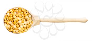 top view of wood spoon with dried split yellow peas isolated on white background