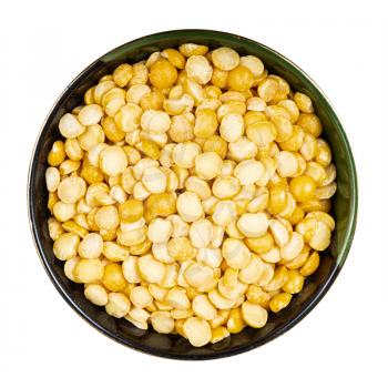 top view of raw dried split yellow peas in round bowl isolated on white background