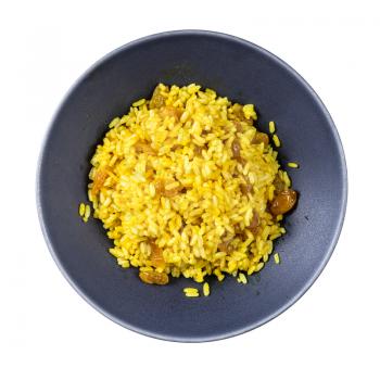 top view of cooked sweet yellow rice porridge with turmeric and raisins from parboiled rice isolated on white background