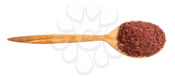 top view of wood spoon with ground sumac isolated on white background