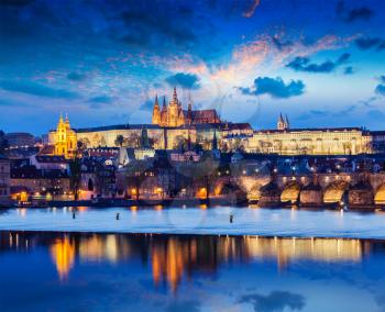 Travel Prague Europe concept background - view of Charles Bridge and Prague Castle in twilight. Prague, Czech Republic