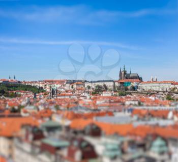 View of Stare Mesto Old City and St. Vitus Cathedral from Town Hall with tilt shift toy effect shallow depth of field. Prague, Czech Republic