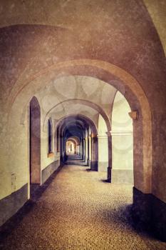 Vintage retro hipster style travel image of arcade in Prague, Czech Republic with grunge texture overlaid