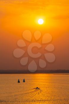 Yacht boats silhouettes in lake on sunset, India