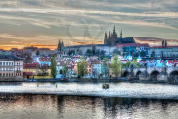HDR image of view of Charles bridge over Vltava river and Gradchany (Prague Castle) and St. Vitus Cathedral