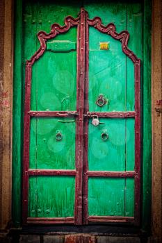 Retro hipster styled image of wooden old door vintage texture background