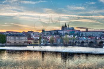 HDR image of view of Charles bridge over Vltava river and Gradchany (Prague Castle) and St. Vitus Cathedral
