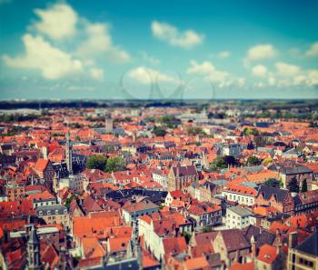 Vintage retro hipster style travel image of aerial view of Bruges (Brugge) from Belfry, Belgium with tilt shift toy effect shallow depth of field
