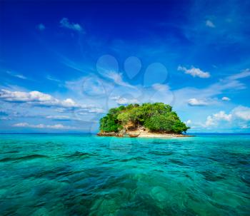 Vacation holidays concept background - tropical island and long-tail boat in sea. Thailand