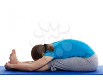Yoga - young beautiful woman yoga instructor doing Seated Forward Bend or Intense Dorsal Stretch pose asana (Paschimottanasana) exercise isolated on white background
