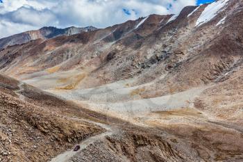 Himalayan valley landscape with road near Kunzum La pass - allegedly the highest motorable pass in the world (5602 m), Ladakh, India
