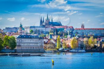 View of Gradchany Prague Castle and St. Vitus Cathedral in daytime over Vltava river