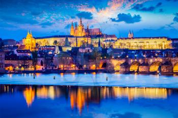 Travel Prague Europe background - view of Prague Castle and St. Vitus cathedral in twilight with dramatic sky. Prague, Czech Republic