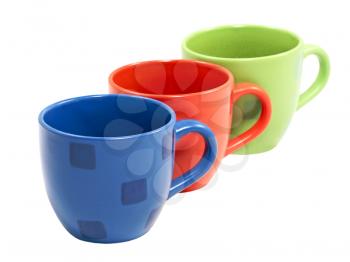 The row of multicolored tea cups isolated on a white background.