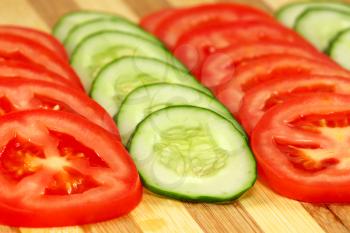 Slices of tomatoes and cucumbers. 