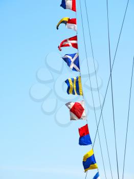 Set of the sea alarm flags on a mast.