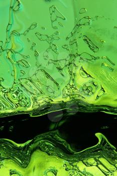 Green liquid texture as abstract background.Digitally generated image.