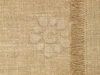 Linen texture pattern with fringe as background.