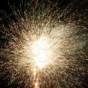 Shining Fireworks Bursts in a Darkness as Abstract Background.