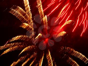Golden And Red Fireworks As Abstract Background.