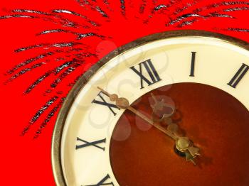 Dial of hours taken closeup and fireworks on red background.Eve of new year.