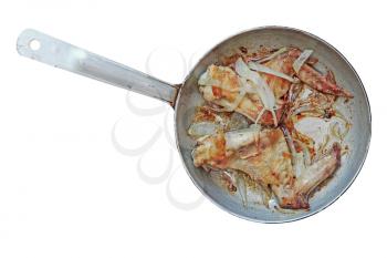 Roasted chicken wings in aluminum frying pan isolated on white background.Top view.